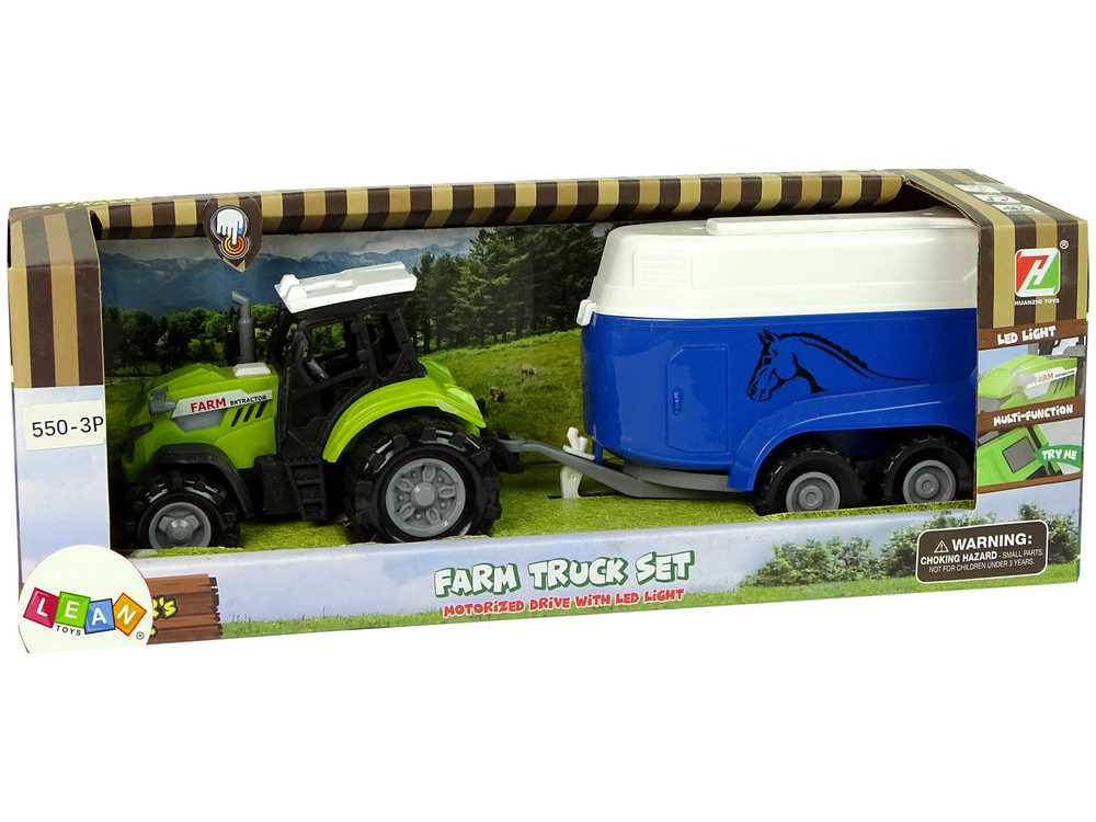 Žalias traktorius su mėlyna arklių priekaba