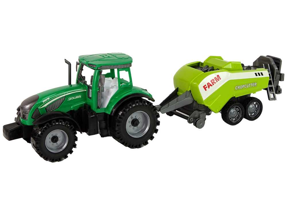 Žalias traktorius su nuimama frikcinės pavaros sėjamąja 