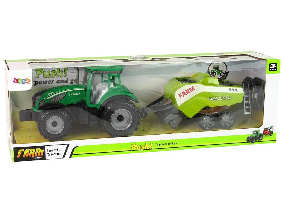 Žalias traktorius su nuimama frikcinės pavaros sėjamąja 