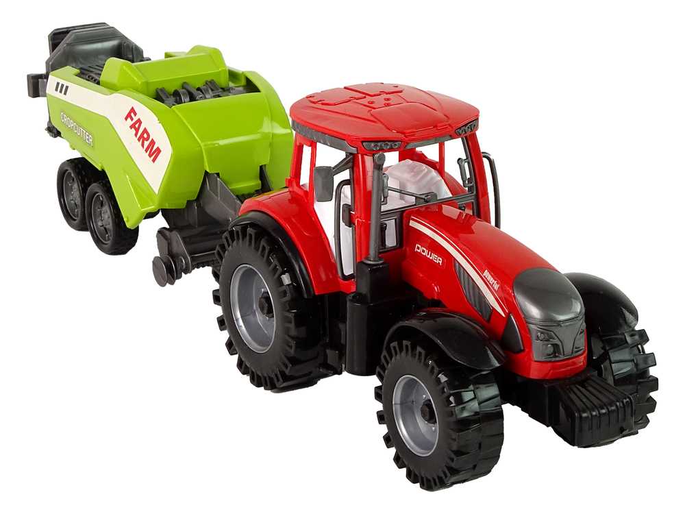 Raudonas žemės ūkio traktorius su žalia sėjamąja frikcine pavara