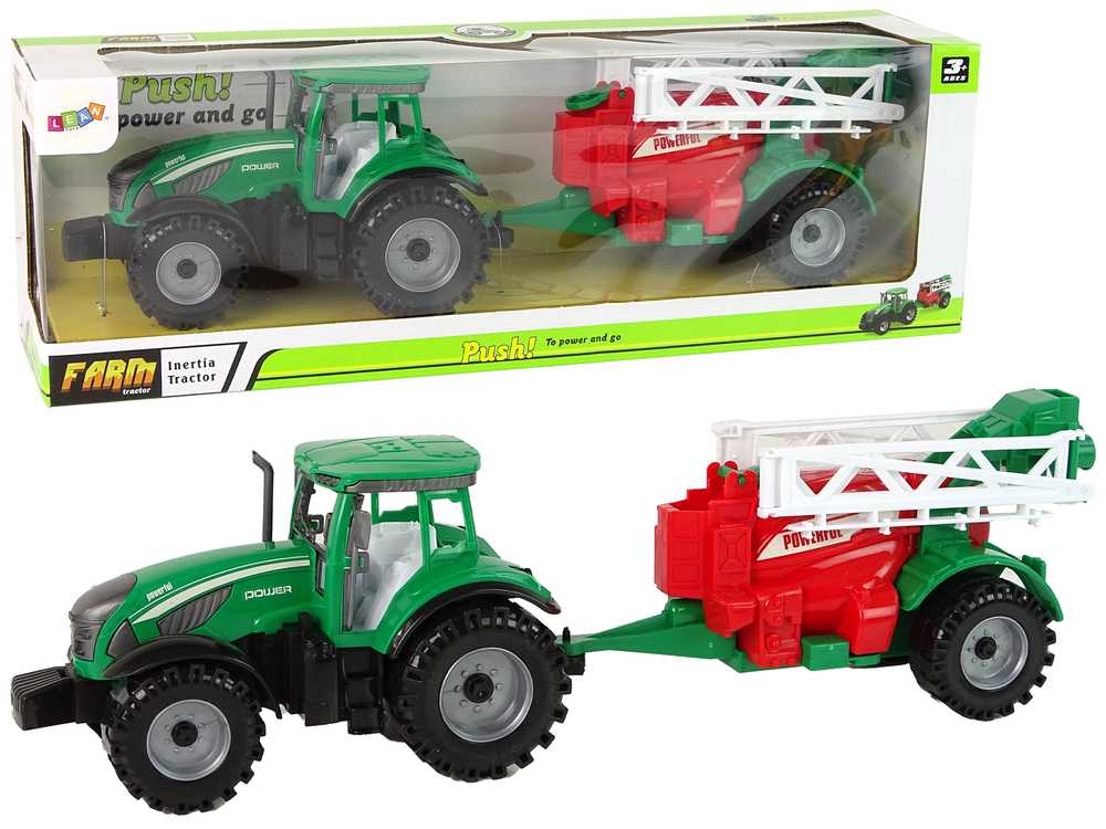 Žalias žemės ūkio traktorius su raudonai žaliu purkštuvu 