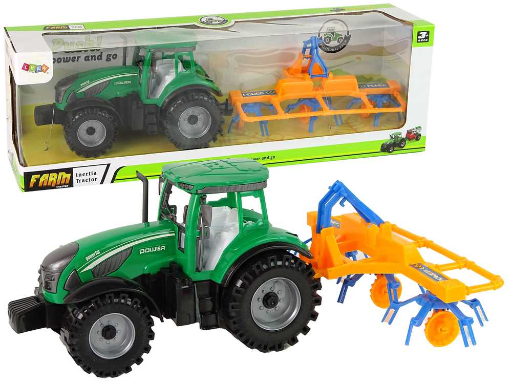 Žalios spalvos traktorius su oranžinės ir mėlynos spalvos grėblio frikcine pavara